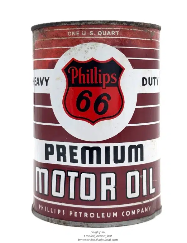 Винтажная жестяная банка моторного масла Phillips 66 Premium с красными полосами и логотипом на белом фоне.