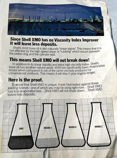 Реклама Shell XMO с графиком испарения масла в колбах и утверждением о меньшем образовании отложений.