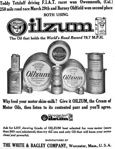 Старинная реклама моторного масла Oilzum с информацией о гонщике Teddy Tetzlaff и мировом рекорде скорости, с изображением банок и слоганами.