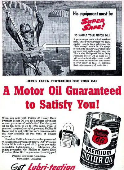 Винтажная реклама моторного масла Phillips 66 с изображением парашютиста для акцента на надежность продукта.